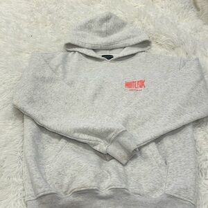 White Fox Archive 6.0 hoodie. Light heather grey with coral puffy logo writing.